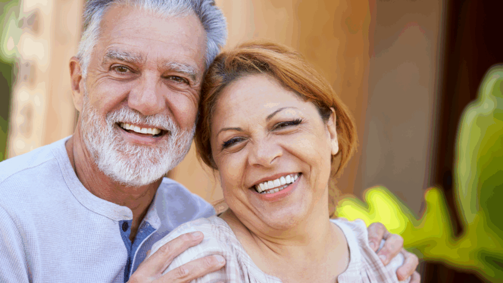 An older woman and an older man smile for a couples photo