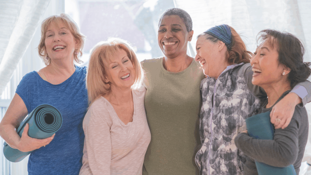 Group of smiling seniors in workout gear