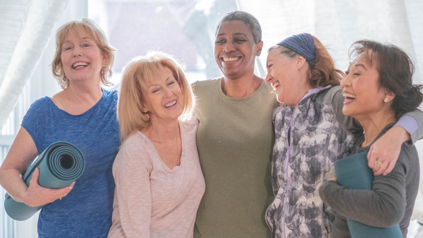 Group of smiling seniors in workout gear